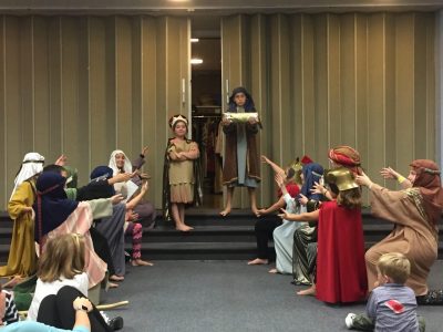 Students performing drama for Sunday school.