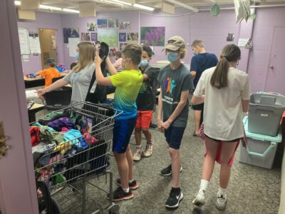 Youth sorting clothes at LifeWise