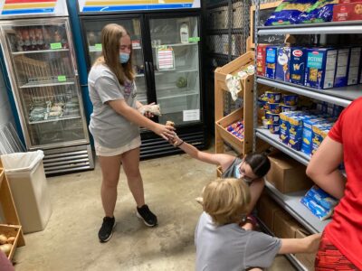 Youth working in Lifewise pantry