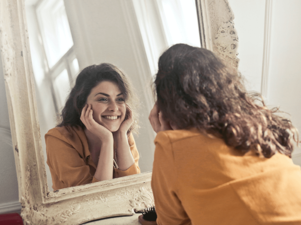 Happy woman smiling in mirror 43