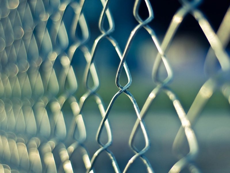 Photo of a chain link fence representing a barrier.