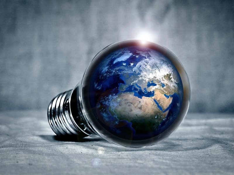 light bulb with planet earth inside