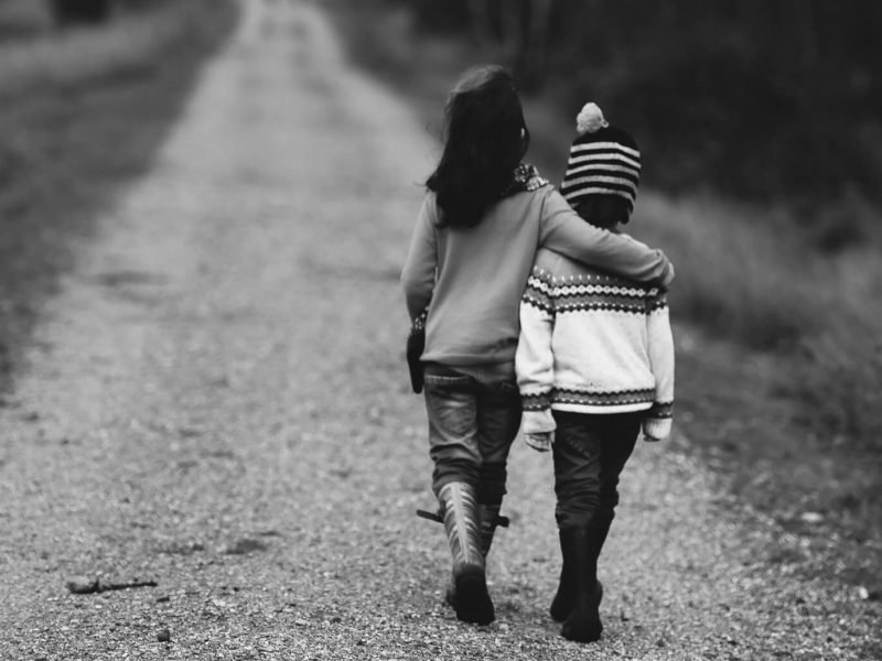 Children walking down a road.